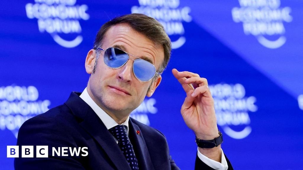 Why was the French president wearing sunglasses indoors at Davos?